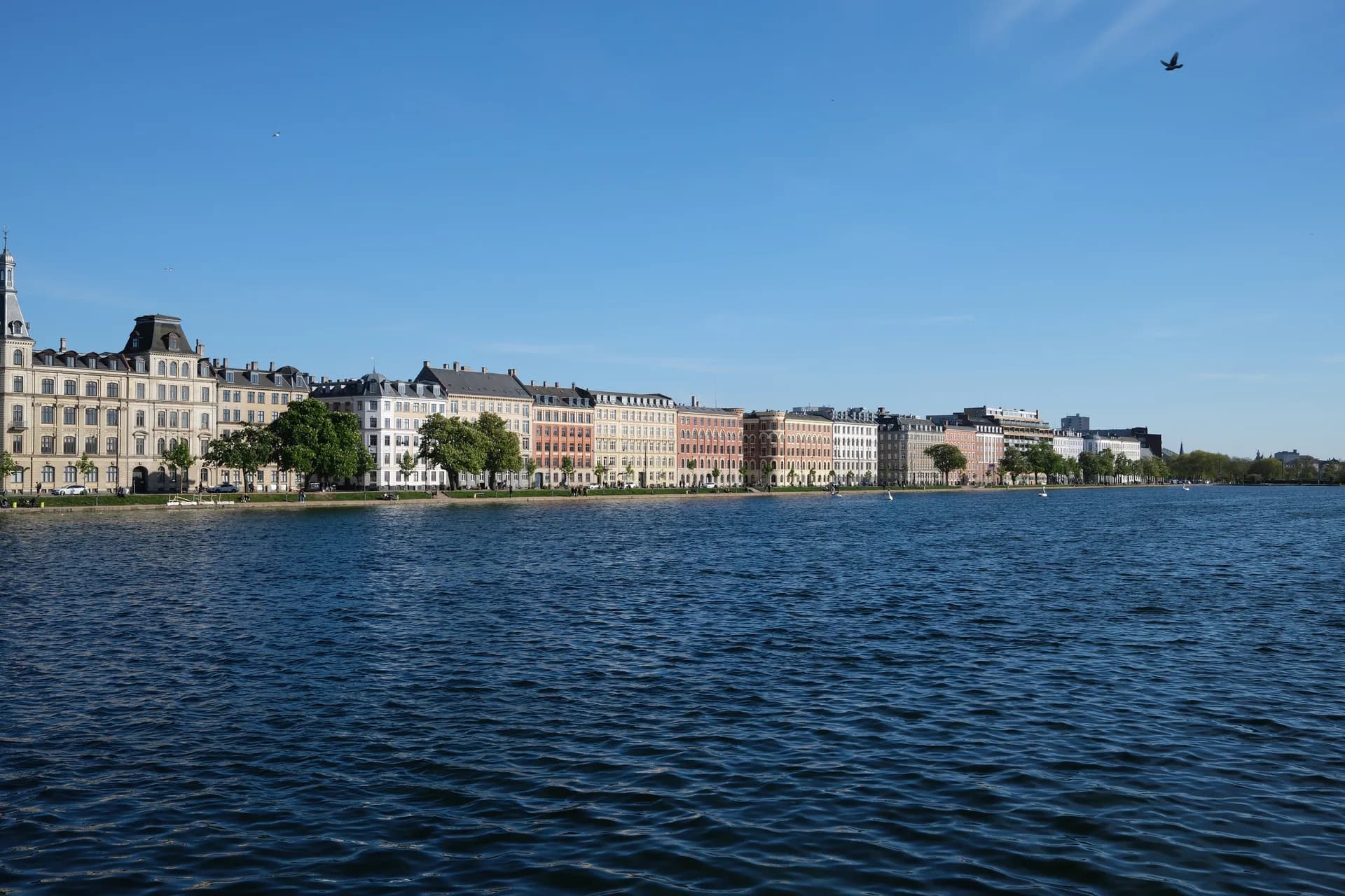 Row of facades along the Copenhagen lakes on a clear day